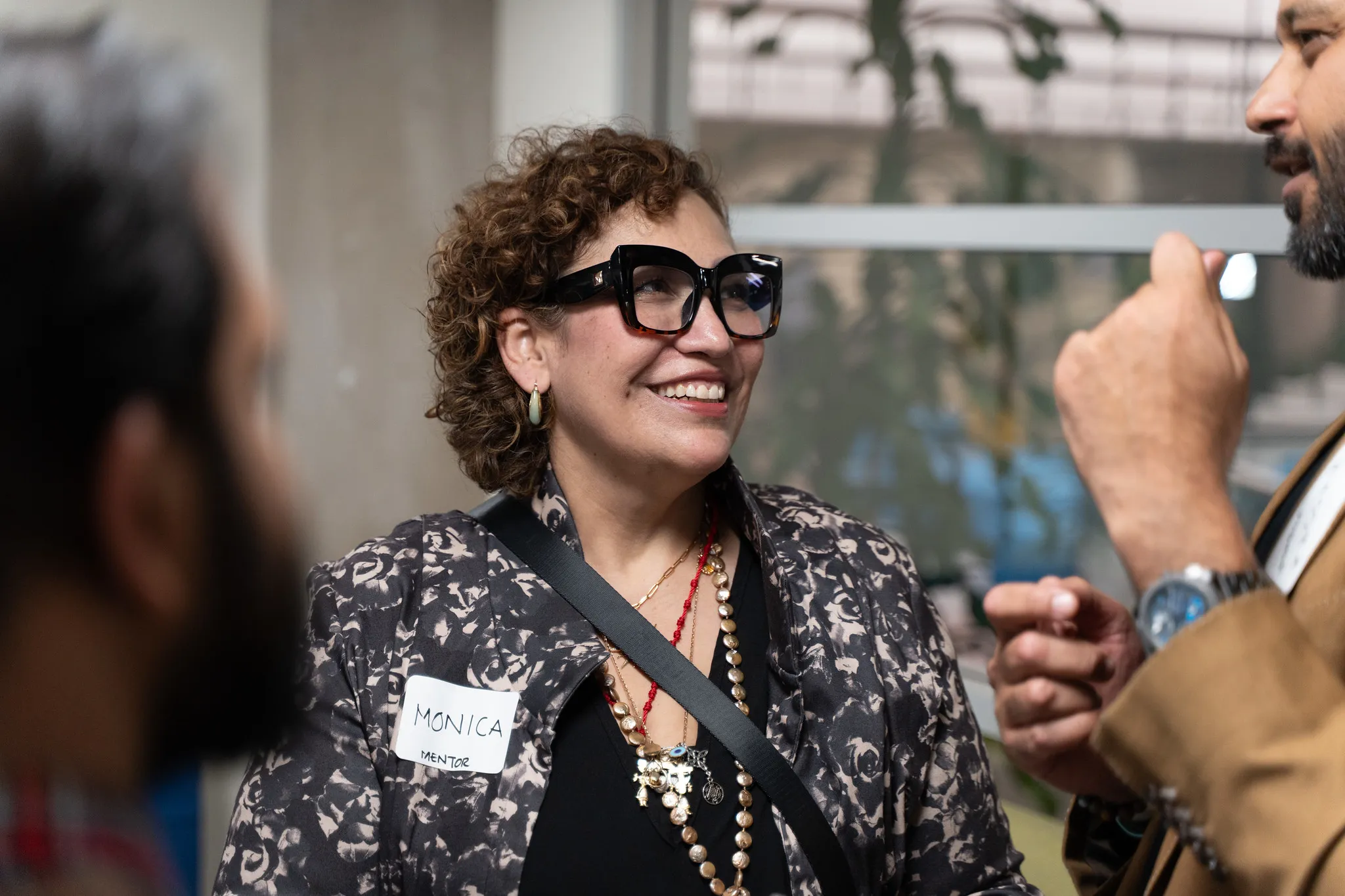 Guests laughing in conversation at the C51 Mentor Social and Best Practices Session
