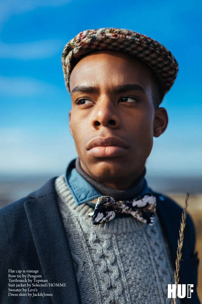 HUF Magazine editorial page: model in a flat cap and floral bow tie under a blue sky