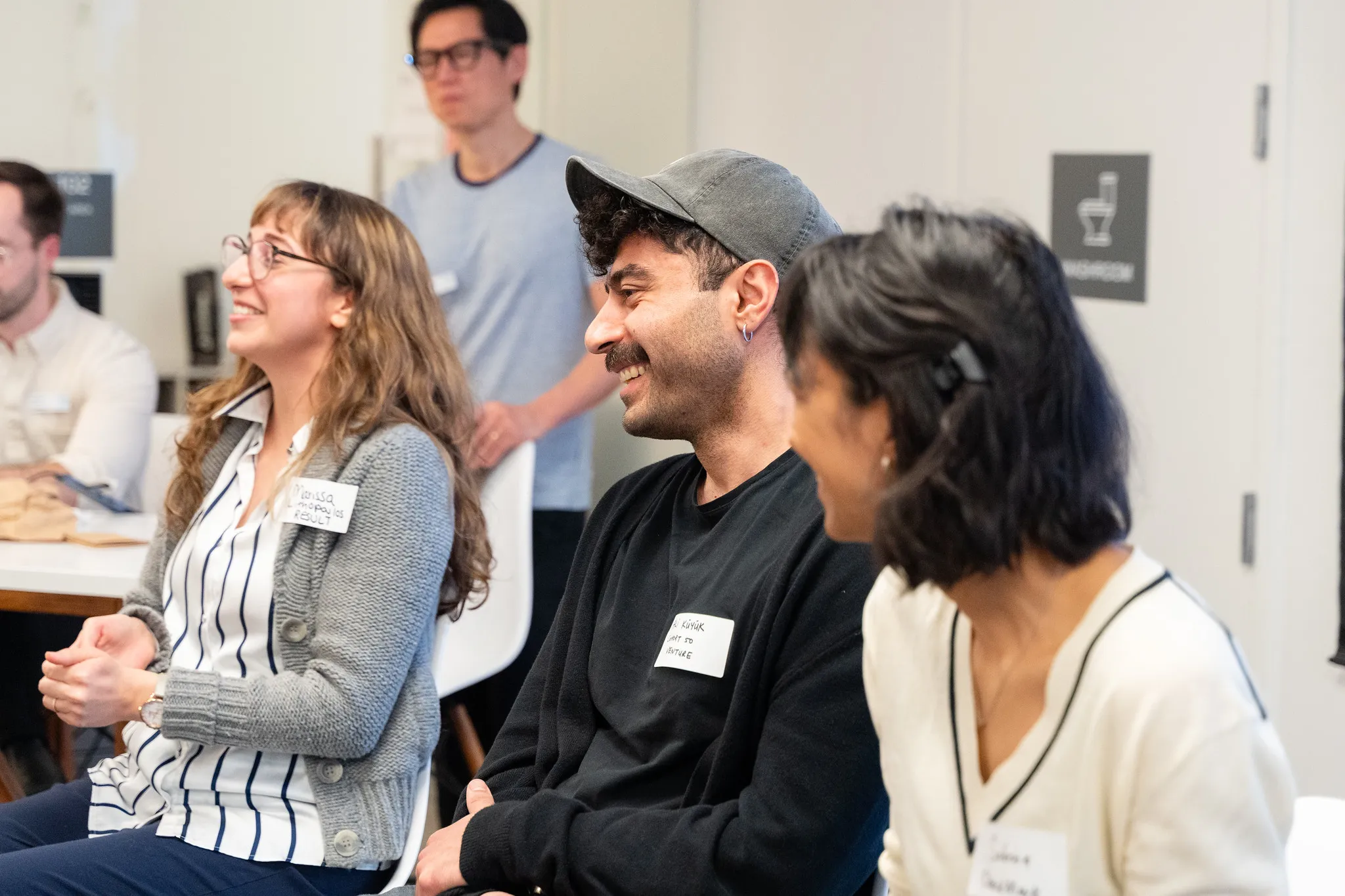 Participants with name tags smiling during the 2026 Venture Founder C51 Orientation